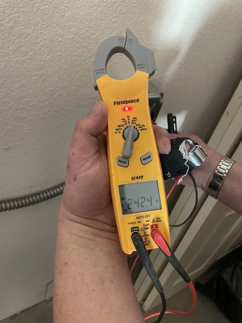 Voltage testing with clamp meter during Circuit Breaker Repair in Grafton